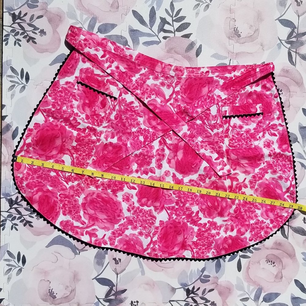 Vintage homemade pink and white floral print waist apron w/ black rickrack trim